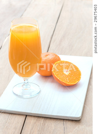 Glass of fresh orange juice with half orange Glass of fresh orange juice with half orange 29675403