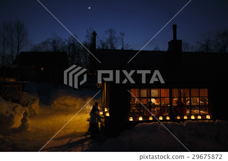 House with a snow candle 29675872