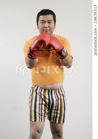 Men taking fighting poses 29676317