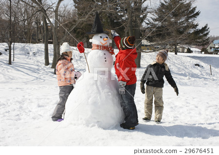 Children making snowmen Children making snowmen 29676451