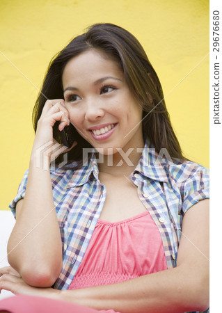 A young woman talking by cell phone 29676680
