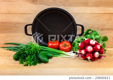 Fresh vegetables and pan on a wooden background 29680821