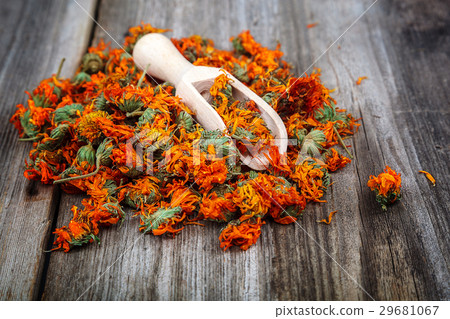 Dried calendula flowers on wooden Medicinal plants 29681067
