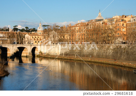cathedral over bridge and river water at fall day 29681618