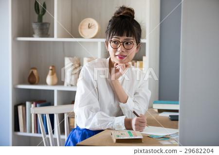 A woman writing a Scandinavian women's letter A woman writing a Scandinavian women's letter 29682204