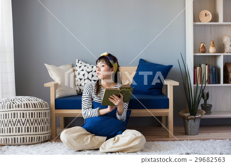 A woman reading a Scandinavian girls book 29682563