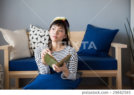 A woman reading a Scandinavian girls book 29682565
