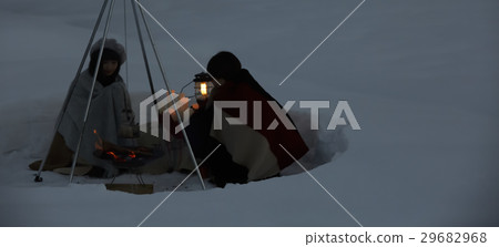 A woman who plays a bonfire on snow A woman who plays a bonfire on snow 29682968