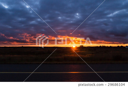 Panoramic view of the sunset among the blue clouds 29686104