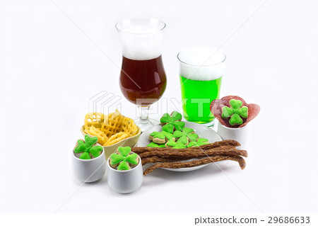 Glass of dark beer glass of green clover plate 29686633