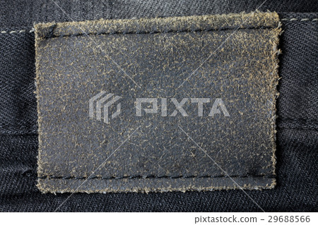 Leather tag on black jeans background Leather tag on black jeans background 29688566