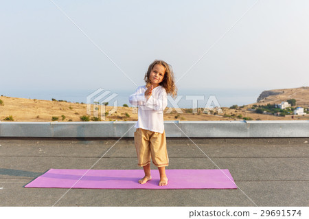Baby doing yoga on the roof Baby doing yoga on the roof 29691574