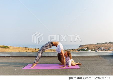 Beautiful boy on the yoga mat Beautiful boy on the yoga mat 29691587