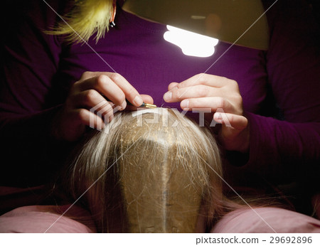 Professional Wig Maker Working in her Workshop. 29692896