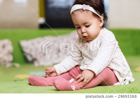 Little 1 year girl sitting on the sofa. Little 1 year girl sitting on the sofa. 29693168