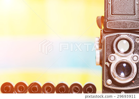 Vintage film camera and film roll with copy space 29693911