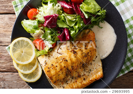 Grilled char fillet with mixed salad and sauce 29693995