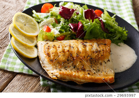 Grilled Arctic char fish with mix salad and sauce Grilled Arctic char fish with mix salad and sauce 29693997
