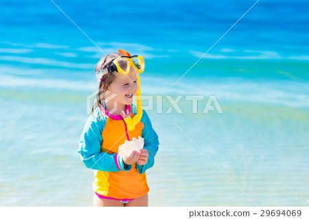 Child snorkeling on tropical beach Child snorkeling on tropical beach 29694069
