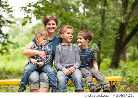 Mother with sons outdoors 29694233