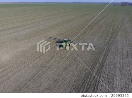 Tractor with hinged system of spraying pesticides Tractor with hinged system of spraying pesticides 29695255