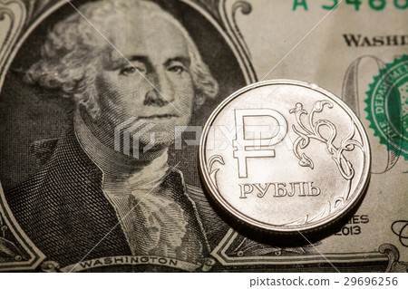 One ruble coin on dollar banknote 29696256