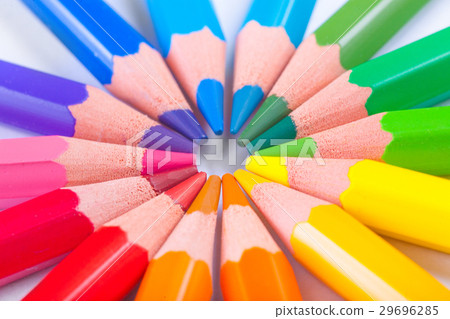 Colored pencils arranged round figure Colored pencils arranged round figure 29696285