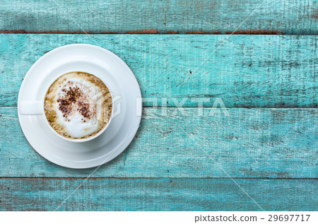 Top view cup of coffee on wooden table. Top view cup of coffee on wooden table. 29697717