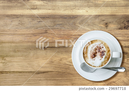 Top view cup of coffee on wooden table. Top view cup of coffee on wooden table. 29697718