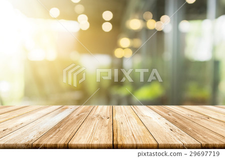 Empty light wood table top with blurred background Empty light wood table top with blurred background 29697719