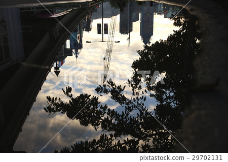 Reflection street in a puddle on the city. Reflection street in a puddle on the city. 29702131