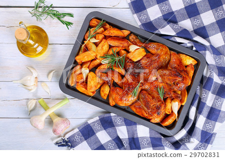 chicken with potato wedges, garlic, top view 29702831
