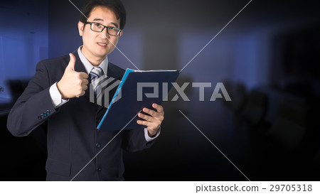 Confident Asian businessman showing notebook Confident Asian businessman showing notebook 29705318