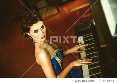 girl in a dress at the piano 29705625