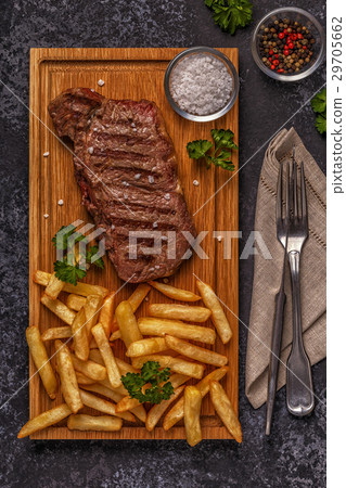 Beef barbecue steak with french fries. 29705662