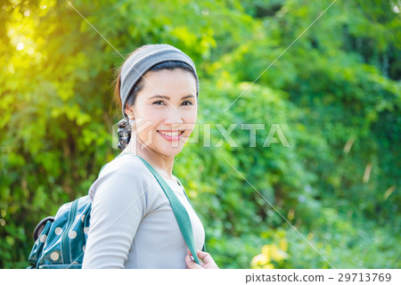 Beautiful asian backpacker in forest 29713769