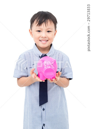 Young boy holding piggy bank over white background Young boy holding piggy bank over white background 29713833