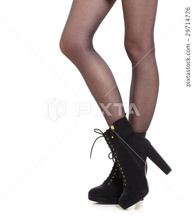 Female legs foots in fashionable black shoes boots Female legs foots in fashionable black shoes boots 29714776