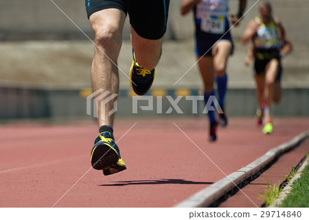 Athletics people running on the track field 29714840