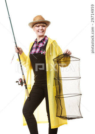 Happy woman holding fishing rod and keepnet Happy woman holding fishing rod and keepnet 29714959