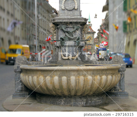 Beautiful fountain in the middle of the street 29716315