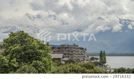 House near the lake and mountains 29716332