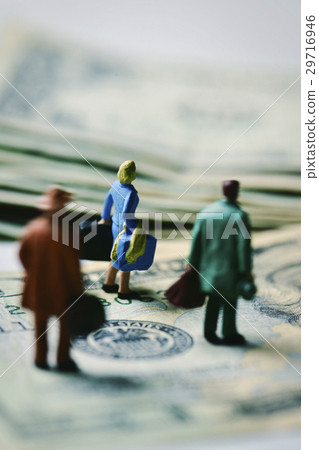 miniature travelers on dollar banknotes 29716946