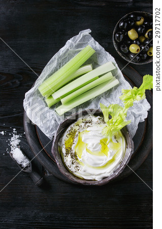 Fresh celery with yogurt dip Fresh celery with yogurt dip 29717702
