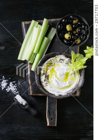 Fresh celery with yogurt dip Fresh celery with yogurt dip 29717703
