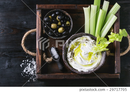 Fresh celery with yogurt dip 29717705
