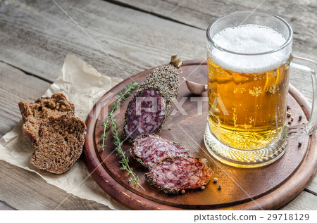 Slices of french Saucisson sausage with beer 29718129