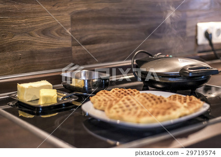 Baking Homemade waffles cooked in a waffle iron Baking Homemade waffles cooked in a waffle iron 29719574