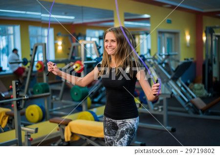 athletic young woman in sportswear exercising with 29719802