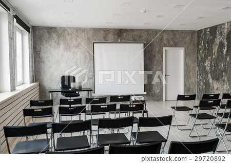 Empty modern classroom with black chairs projector 29720892
